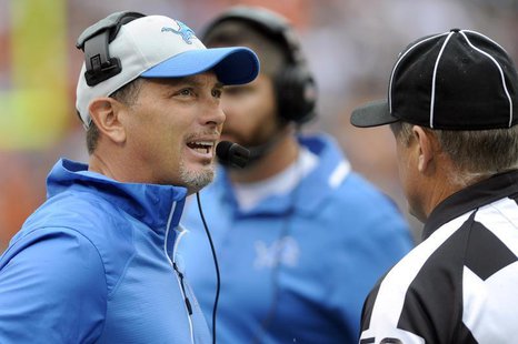 Detroit Lions head coach Jim Schwartz talks with the officials during the third quarter against the Cleveland Browns at First Energy Stadium