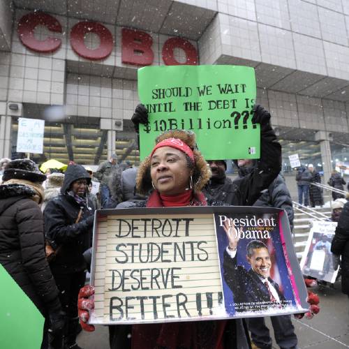 High School teacher Debrah Baskin 53 of Southfield and other teachers from Detroit area schools protest outside the Cobo Center Wednesday Jan. 20 2106 only hours before President Barack Obama's visit to the auto
