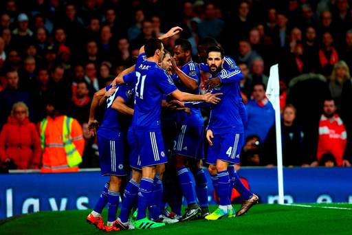 Diego Costa of Chelsea celebrates with team-mates after scoring the opening goal