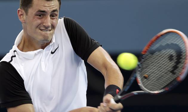 Bernard Tomic of Australia plays a shot in his quarterfinal game against Kei Nishikori of Japan during the Brisbane International tennis tournament in Brisbane Australia Friday Jan. 8 2016