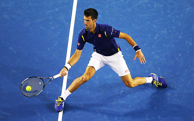 Djokovic plays a forehand in his semi-final match against Roger Federer