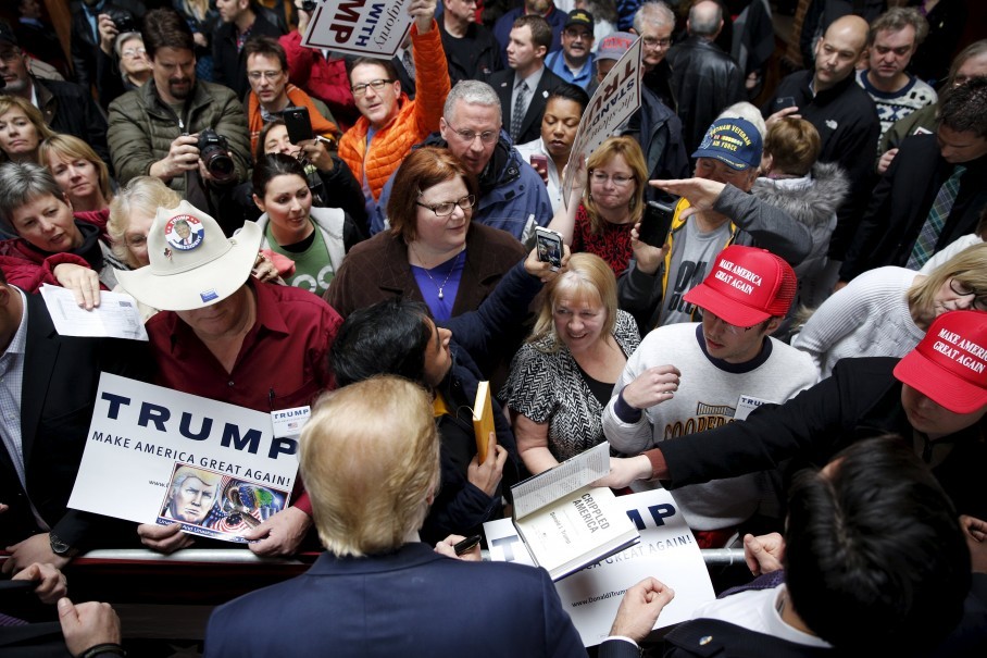 Donald Trump signs autographs after speaking at a campaign rally at Living History Farms in Urbandale Iowa on Jan. 15