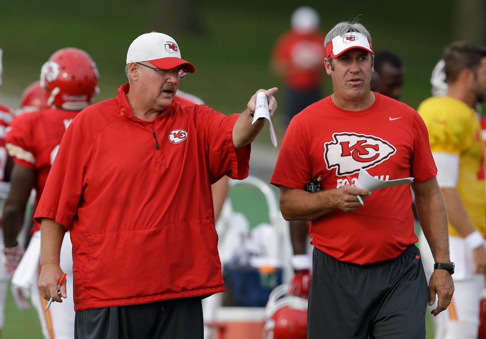 Kansas City Chiefs head coach Andy Reid left and offensive coordinator Doug Pederson right talk during NFL football training camp in St. Joseph Mo