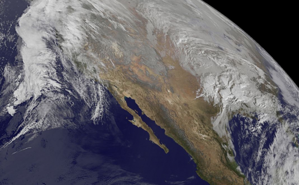 NOAA's GOES-West satellite imagery from Jan. 21 at 10 a.m. EST shows the large winter storm over near the Gulf coast and another storm approaching the Pacific coast