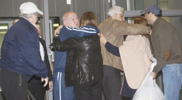 Families and friends of the five Americans released by Tehran receive them in Houston Texas yesterday