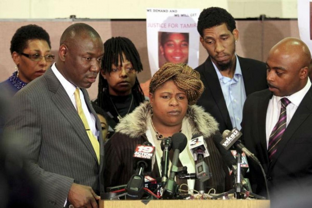 Samaria Rice, the mother of Tamir Rice the 12-year old boy who was fatally shot by police last month while carrying what turned out to be a replica toy gun speaks surrounded by Benjamin Crump, Leonard Warner and Walter Madison during