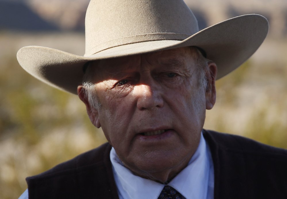 Rancher Cliven Bundy the father of Ammon and Ryan Bundy speaks to media near his ranch Wednesday in Bunkerville Nev. Cliven Bundy and his wife Carol Bundy were returning from a trip to visit the family of La Voy Finicum a 55-year-old rancher from Cai