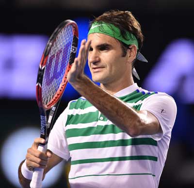 Switzerland’s Roger Federer celebrates after victory in his men’s singles match against Belgium’s David Goffin on day seven of the 2016 Australian Open tennis tournament in Melbourne on Sunday. AFP