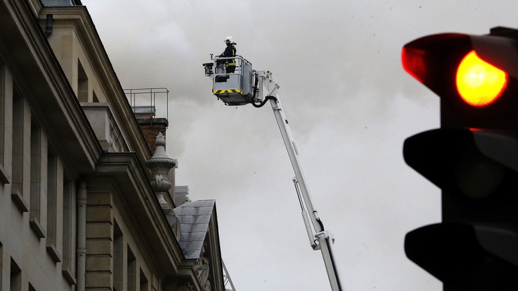 Firefighters are battling a blaze in the roof of the luxury Ritz Paris hotel in Place Vendome