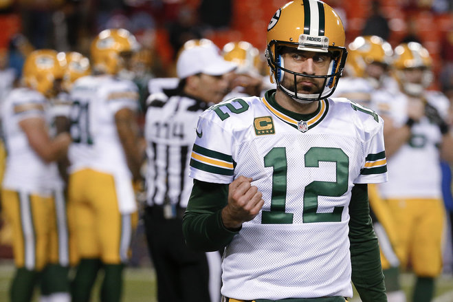 Green Bay Packers quarterback Aaron Rodgers pumps his fist as he walks off the field in the closing minutes of the team's NFL wild-card playoff football game against the Washington Redskins in Landover Md. Sunday Jan. 10 2016. The Packers won 35-18