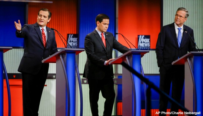 Republican presidential candidate Sen. Ted Cruz R-Texas left answers a question as Sen. Marco Rubio R-Fla. center listens and former Florida Gov. Jeb Bush right looks on during a Republican presidential primary debate Thursday Jan. 28 2016