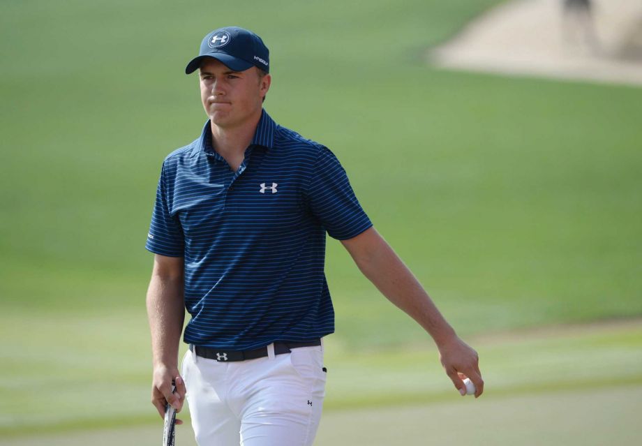 Jordan Spieth of the United States the world number one reacts after the putt on the 17th green during round two of the fog-delayed Abu Dhabi Golf Championship in Abu Dhabi United Arab Emirates Saturday Jan. 23 2016