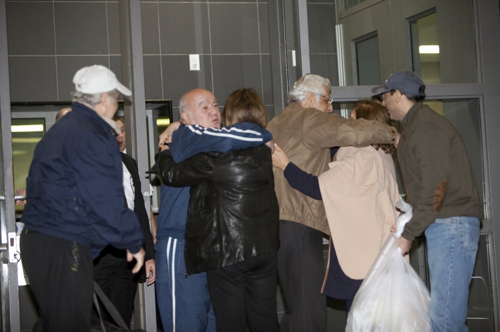 Family and friends embrace Bahram Mechanic and Khosrow Afghahi at Federal Detention Center Houston Texas today. Several Iranian Americans held in US prisons after being charged or convicted for sanctions violat