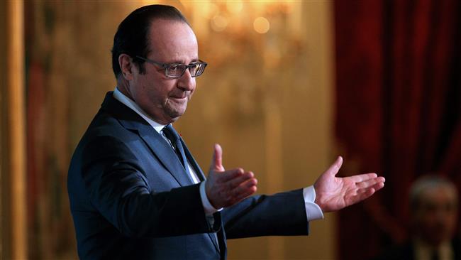 French President Francois Hollande speaks to the media