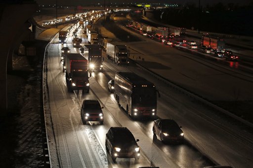 Traffic is bumper to bumper and mostly at a stand-still on the outer loop of the I-495 Capital Beltway after snow fell Wednesday Jan. 20 2016 in National Harbor Md. As Washington prepares for this weekend's snowstorm now forecast to reach blizza