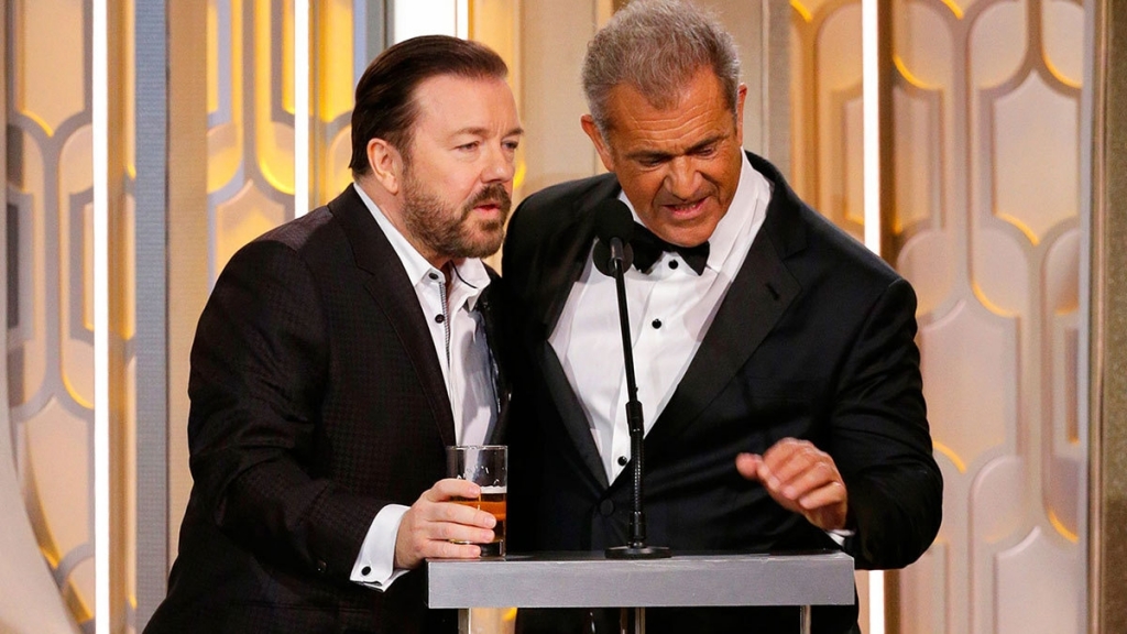 Gervais drinking beer throughout the Golden Globes theatrically whisked his pint glass away as Gibson approached the podium.─AP