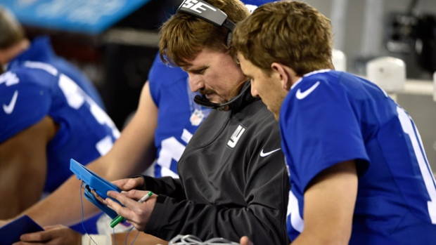 Ben McAdoo centre shown going over plays with Giants&#39 quarterback Eli Manning is moving up from his offensive coordinator role to head coach succeeding Tom Coughlin according to a report