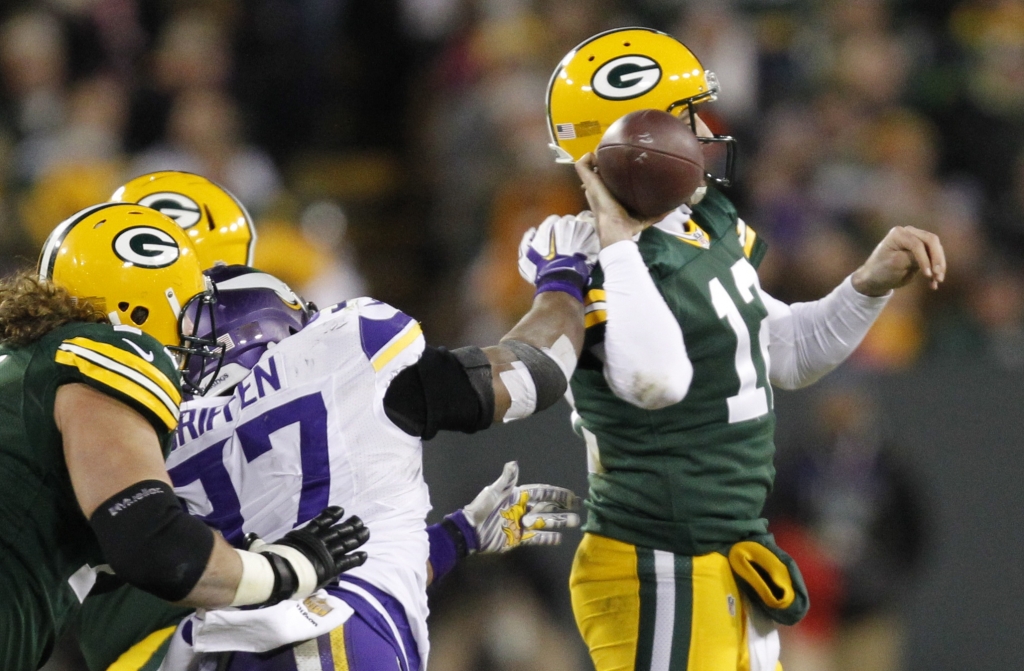 Green Bay Packers&#039 Aaron Rodgers fumbles as he is hit by Minnesota Vikings&#039 Everson Griffen during the second half an NFL football game Sunday Jan. 3 2016 in Green Bay Wis