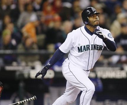 Ken Griffey Jr. hitting a solo home run on a pitch from Texas Rangers&#039 Tommy Hunter during the fourth inning of a baseball game in Seattle. Ken Griffey Jr. seems assured of