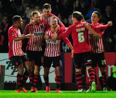 Gritty Grecians Exeter City's Lee Holmes celebrates after scoring his side's second goal against Liverpool