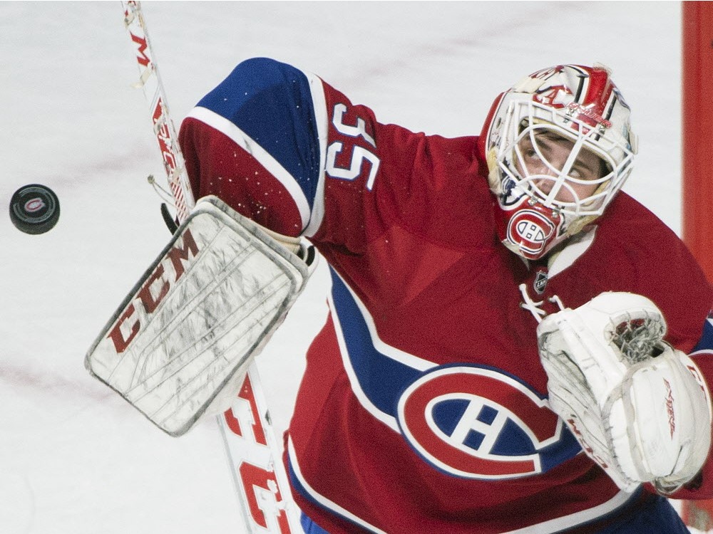 Montreal Canadiens&#039 goaltender Dustin Tokarski makes a save against the Ottawa Senators during first period NHL hockey action in Montreal on Saturday Dec. 12 2015