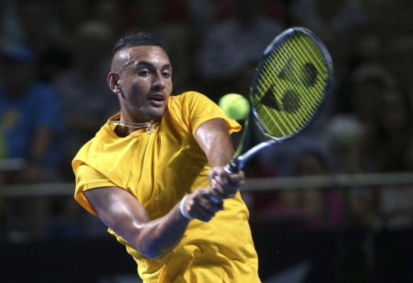 Nick Kyrgios of Australia plays a shot