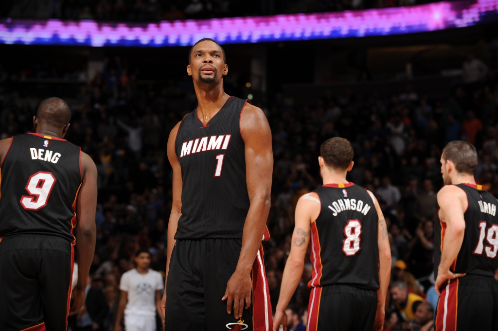 Chris Bosh #1 of the Miami Heat looks on during the game against the Denver Nuggets