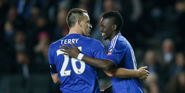 Chelsea's Bertrand Traore right celebrates scoring his side's fifth goal with captain John Terry during the English FA Cup fourth round match