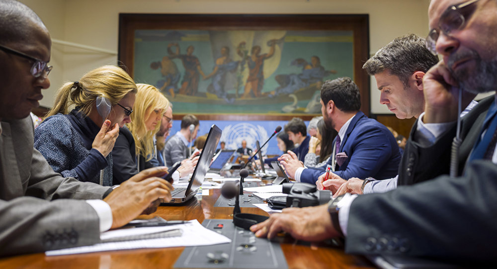 Jounalists attend a breifing at the United Nations Offices on the opening day of Syrian peace talks in Geneva