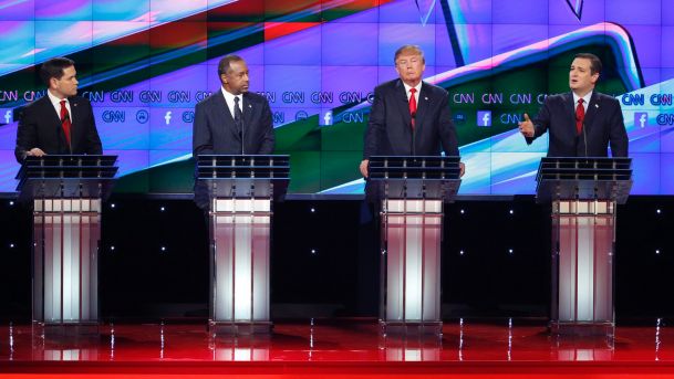 Ted Cruz right speaks during an exchange with Marco Rubio left as Ben Carson second from left and Donald Trump look on during the CNN Republican presidential debate at the Venetian Hotel & Casino on Tuesday Dec. 15 2015 in Las Vegas