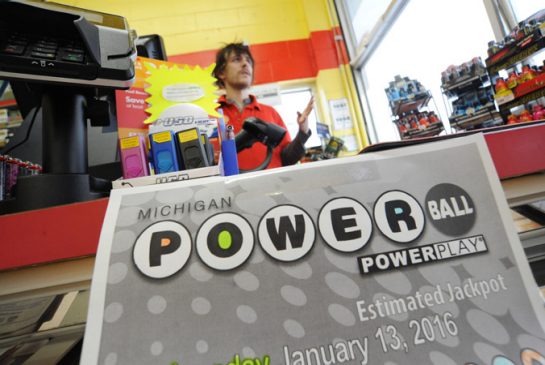 Matthew Curtis a clerk at the Shell gas station in St. Joseph Mich. talks about the upcoming Powerball lottery Tuesday Jan. 12 2016. The Powerball lottery jackpot has risen over one billion with the next drawing occurring Wednesday night