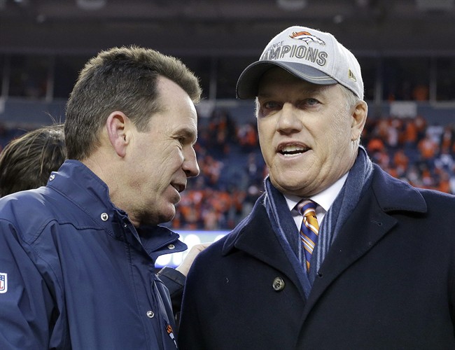 Denver Broncos general manager and executive vice president of football operations John Elway right speaks with head coach Gary Kubiak following the AFC Championship game between the Denver Broncos and the New England Patriots Sunday Jan. 24 2016