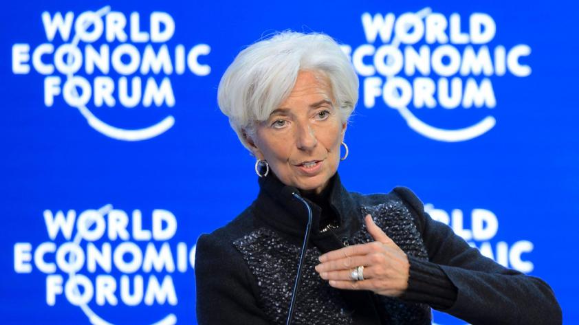 IMF Managing Director Christine Lagarde gestures during a session of the World Economic Forum annual meeting in Davos yesterday