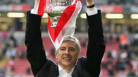 Image Text
 ALL MINE Arsene Wenger holds the FA Cup aloft