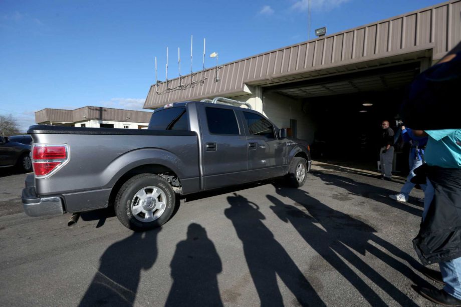 Texas Rangers deliver indicted state trooper Brian Encinia to the Waller County Jail on Thursday. Encinia surrendered after his indictment for perjury in the arrest of Sandra Bland