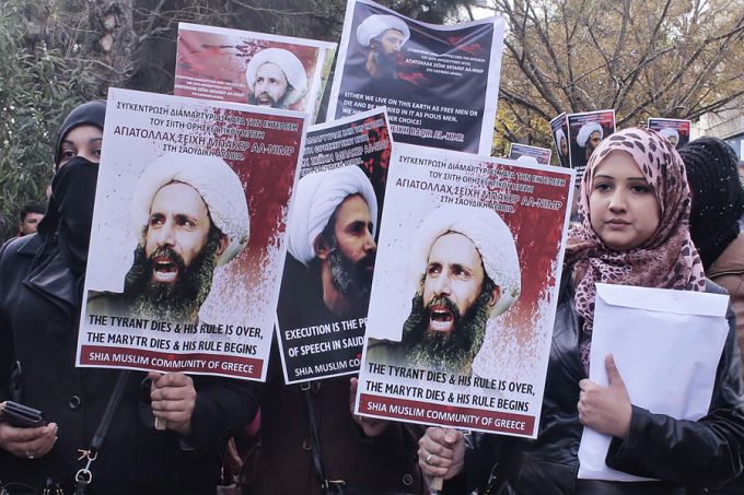 Members of Shia Muslim community of Greece hold posters of Sheikh Nimr al Nimr during a protest rally outside of Saudi Arabia's embassy on January 6. 2016