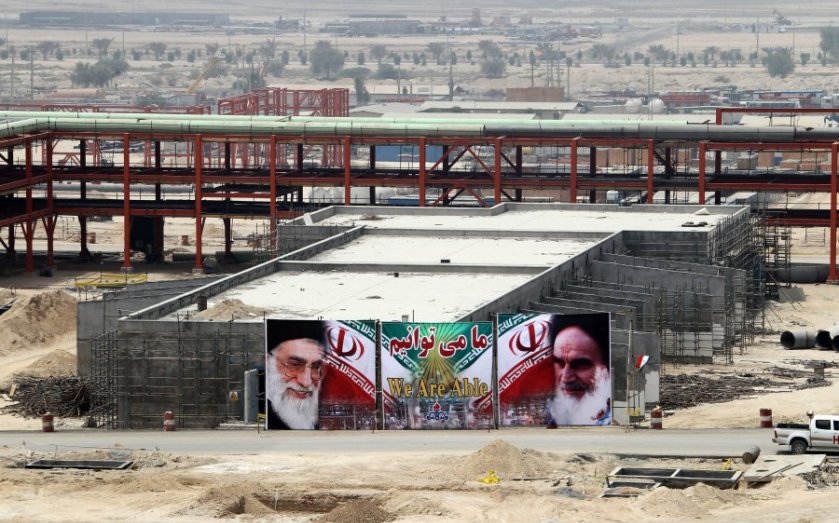 A huge banner bearing portraits of Iran