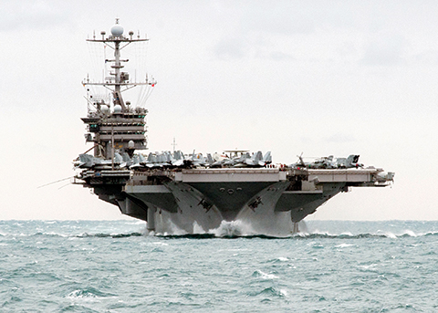 U.S. Navy the aircraft carrier USS Harry S. Truman transits the Strait of Hormuz. Iranian naval vessels conducted rocket tests last week near the USS Harry S. Truman aircraft carrier the USS Bulkeley