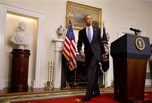 President Barack Obama leaves the podium after speaking about the release of Americans by Iran on Sunday in the Cabinet Room of the White House in Washington