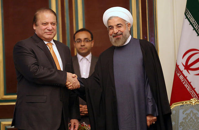 Iranian President Hassan Rouhani shakes hands with Pakistani Prime Minister Nawaz Sharif at an official meeting in 2014