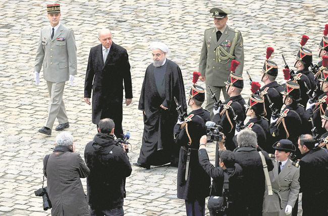 Iranian president hails ‘new relationship’ with France    
                       
        Iranian President Hassan Rouhani center right inspects the honor guard in Paris Thu