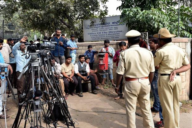 Media waits at the entrance of the FSL Bengaluru where NIA is interrogating the detained 4 suspected ISIS sympathizers ahead of the Republic Day