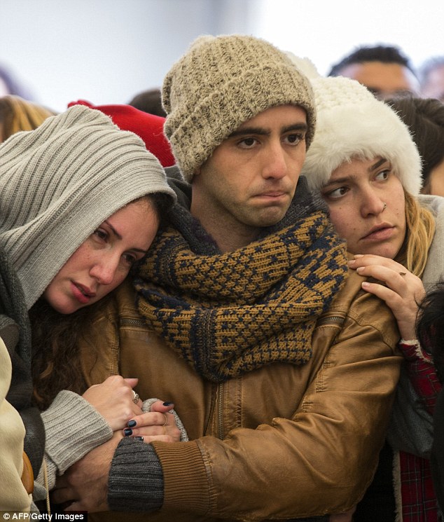 Mourning Israeli police continue to hunt for the gunman who also wounded several people