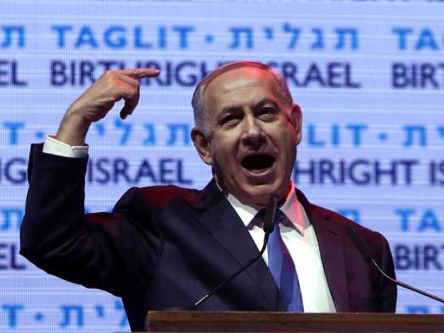 Israeli Prime Minister Benjamin Netanyahu gestures as he speaks during the Taglit Birthright annual event in Jerusalem