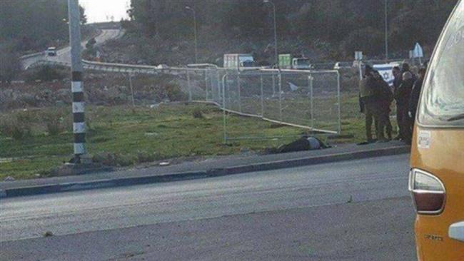 Israeli soldiers gather around the body of a Palestinian man after killing him at the Gush Etzion junction in the West Bank