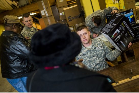 Residents of Flint receiving free water filters from U.S. National Guard soldiers