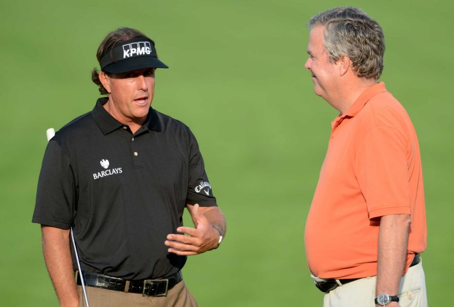 Pro golfer Phil Mickelson left talks to his ﻿amateur partner former Florida Gov. Jeb Bush during The Barclays Pro Am golf tournament﻿ in 2012. ﻿Political observers say the rise of outsider anger championed by Donald Trump and Sen. Ted Cruz may