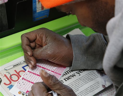 Jermaine Emory Mallory fills out a Powerball number selection slip at a store in Oklahoma City Tuesday Jan. 5 2016