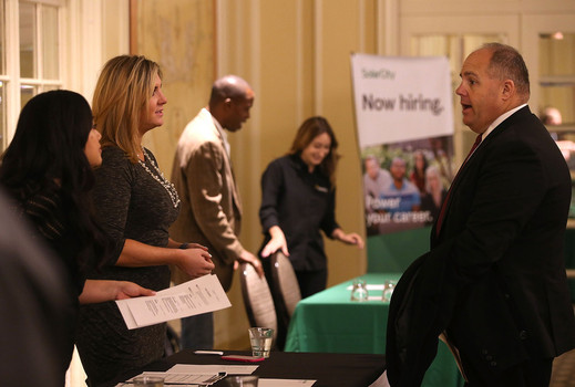 Job seekers at this job fair are finding jobs. The economy added nearly 300,000 jobs in December