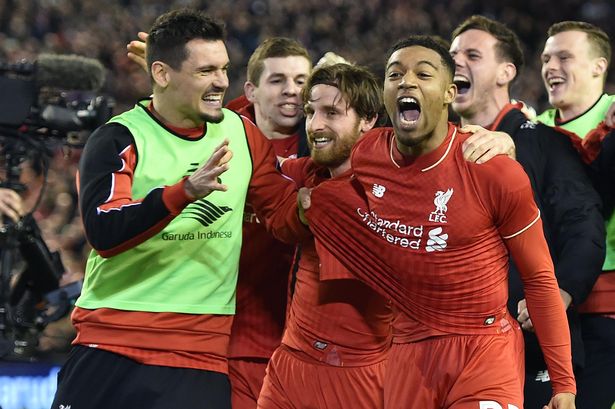 Joe Allen centre is mobbed by his teammates after firing home the winning penalty for Liverpool